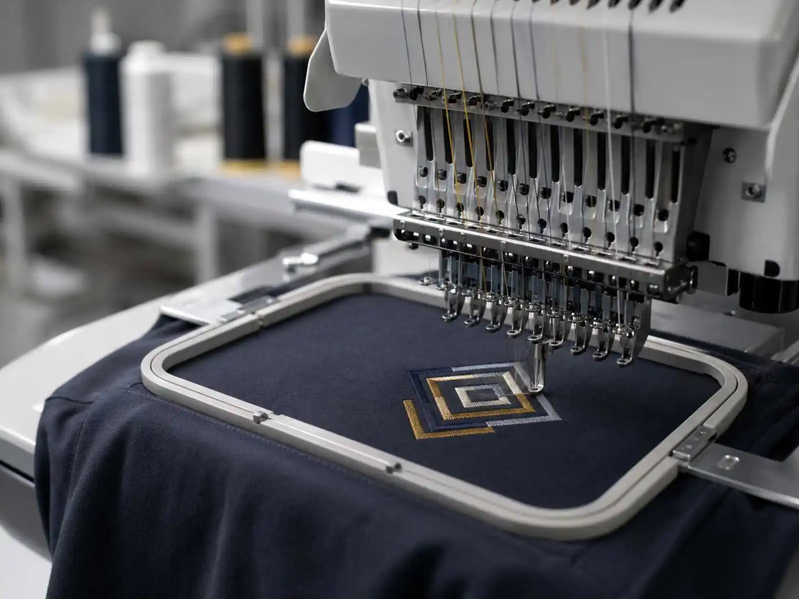Garment printing and embroidery production supporting branded apparel finishing programmes