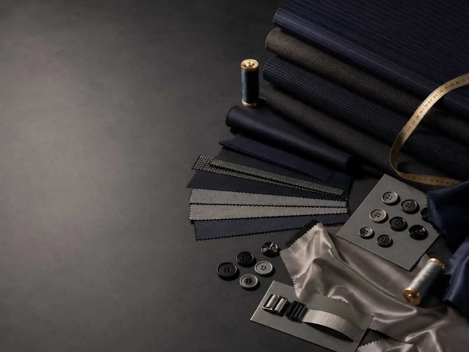 Corporate uniform suiting fabrics, colour swatches and trim options prepared for programme development